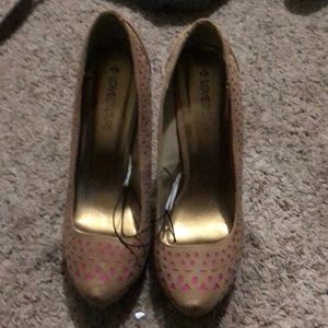 Tan and pink laser cut heels.